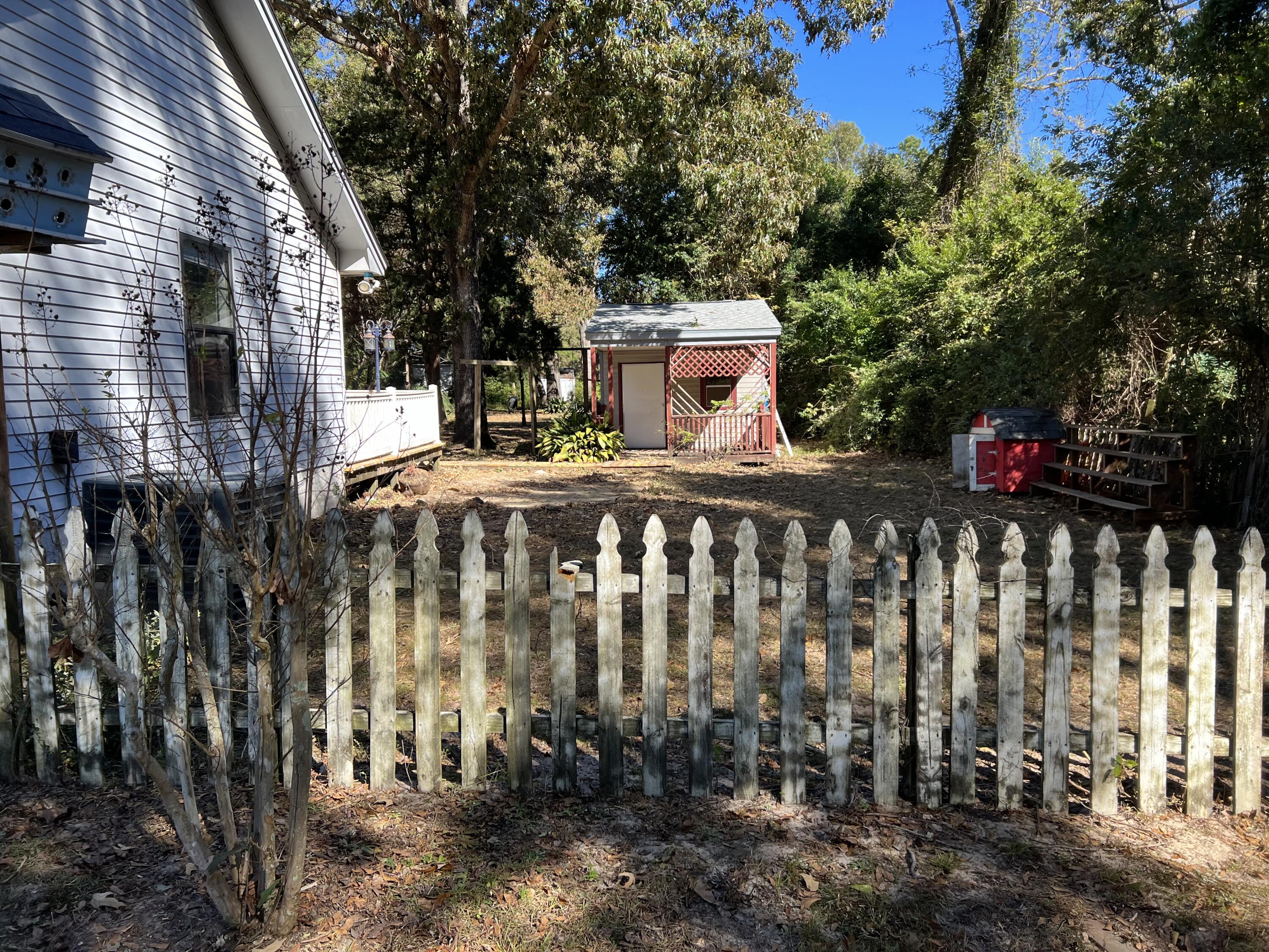 6028 Old Bethel Road Crestview, FL 32536 - Photo 3 of 16 a view of a house with a wooden fence