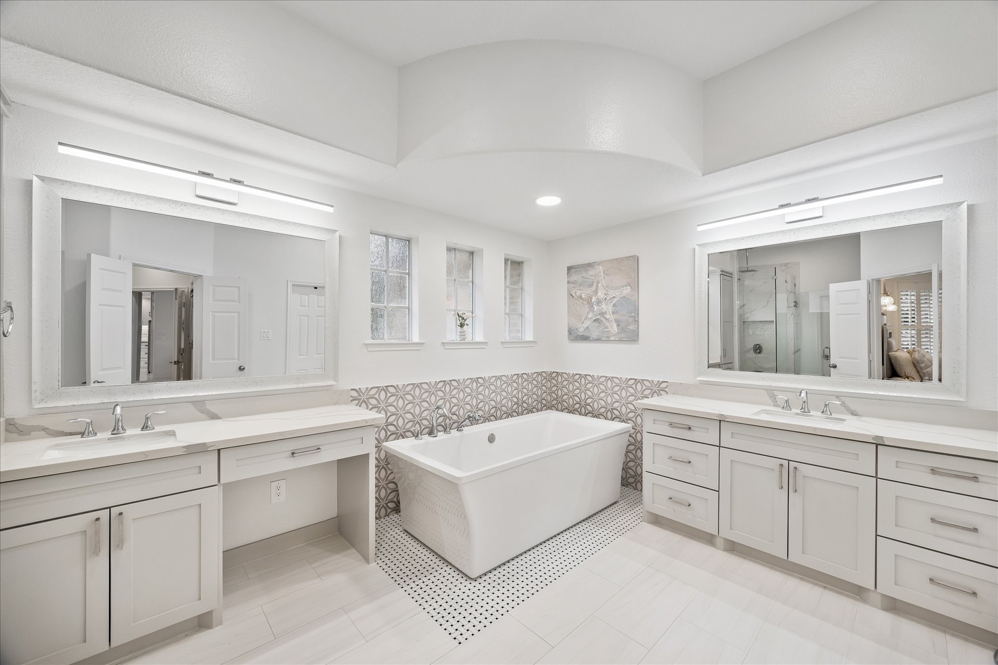 15 West Beckonvale Circle The Woodlands, TX 77382 - Photo 19 of 44 The spacious primary bathroom features a large stand-alone tub, separate walk-in shower, creating a tranquil setting for daily relaxation. Lovely updates and thoughtful design make this space both functional and inviting.