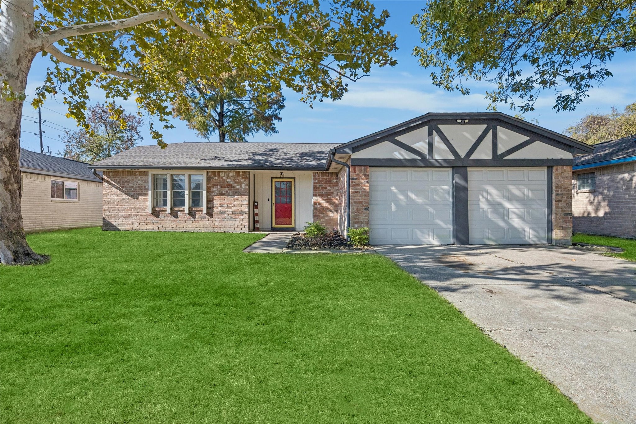 a front view of house with yard and green space
