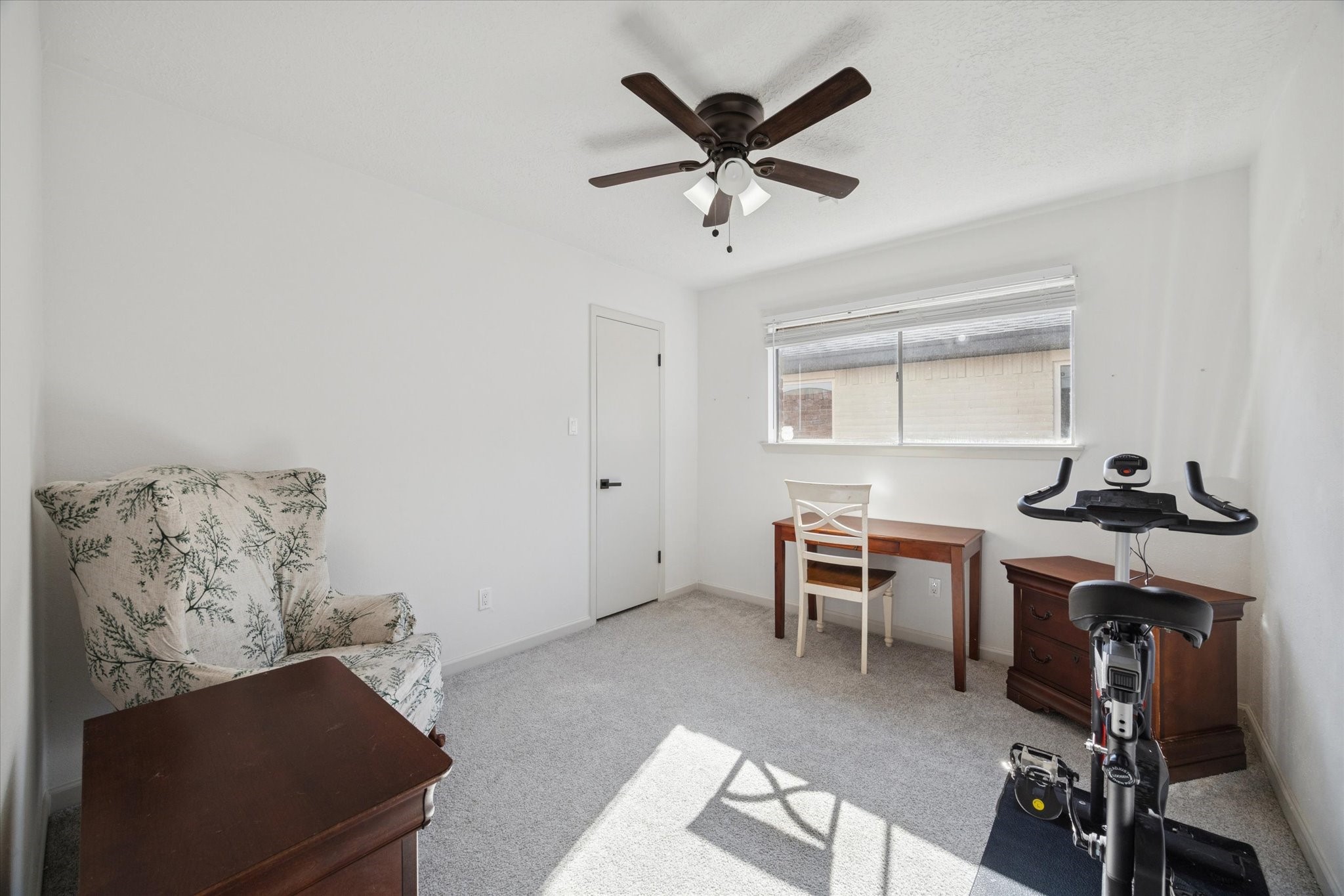 11207 Rousseau Drive Houston, TX 77065 - Photo 16 of 20 a view of a workspace with furniture and a window