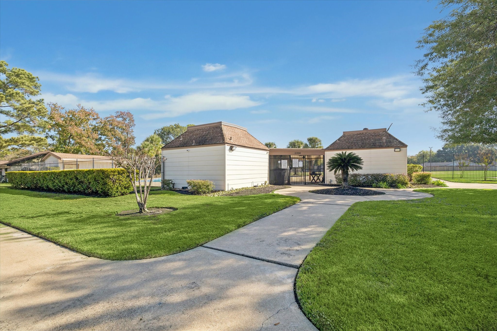 11207 Rousseau Drive Houston, TX 77065 - Photo 18 of 20 a front view of a house with a yard