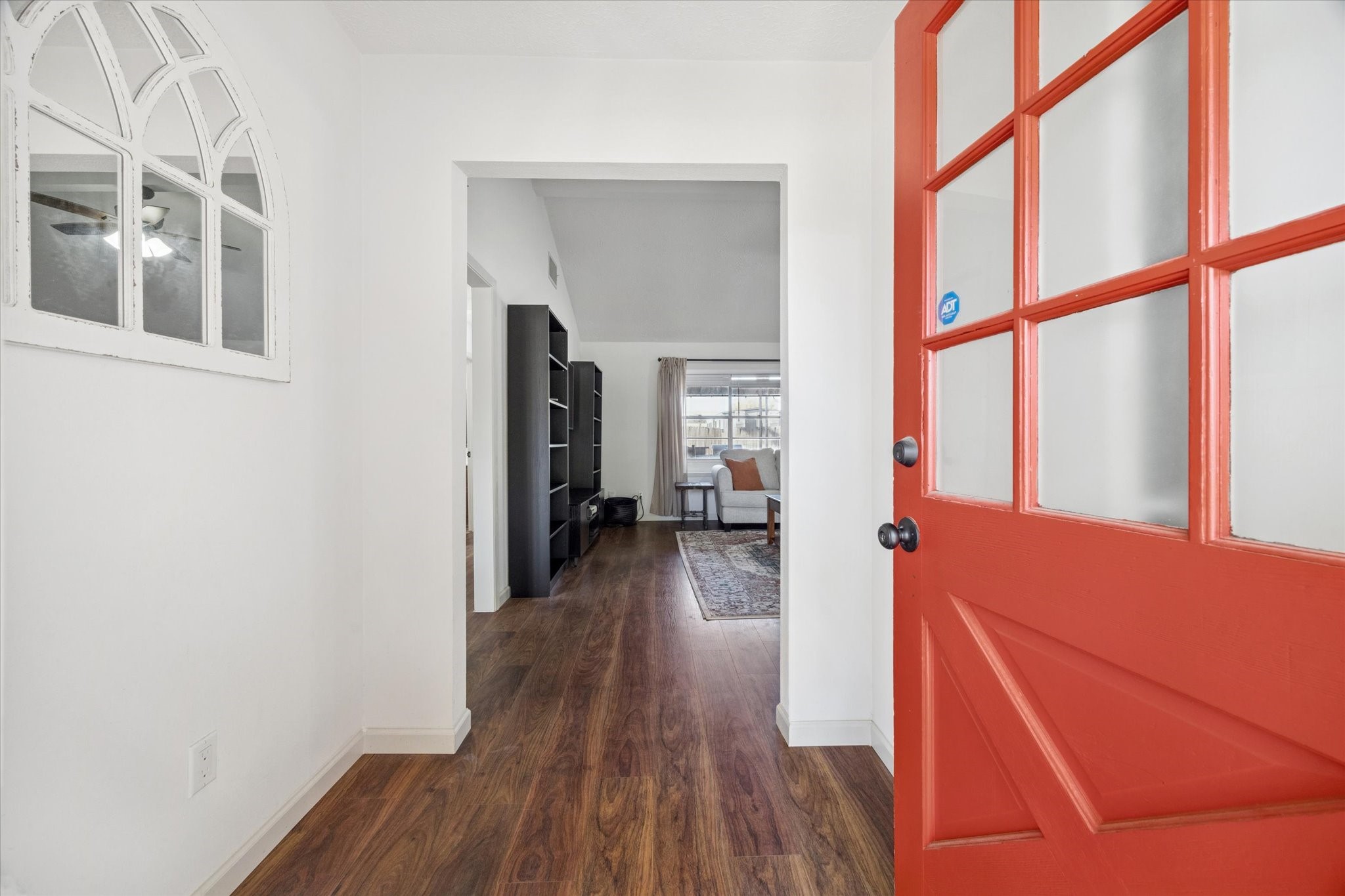 11207 Rousseau Drive Houston, TX 77065 - Photo 4 of 20 a view of hallway with wooden floor and stairs