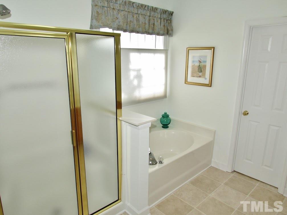 4720 Treadstone Court Raleigh, NC 27616 - Photo 10 of 25 Your master bath offers a separate shower and garden tub. Create your own private oasis... your own slice of heaven!