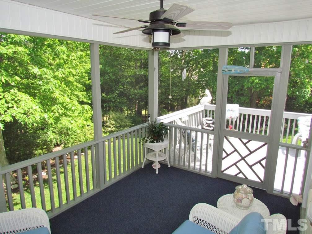4720 Treadstone Court Raleigh, NC 27616 - Photo 13 of 25 Your screened porch also offers a ceiling fan and opens out to a large composite deck.