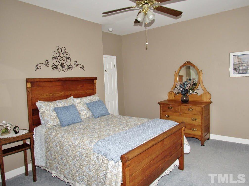 4720 Treadstone Court Raleigh, NC 27616 - Photo 25 of 25 This bedroom is as big as some master bedrooms. It is located next to the hall bath for convenience. This floorplan is a split floorplan that has the 2nd and 3rd bedrooms on one side of the home and the master on the other.