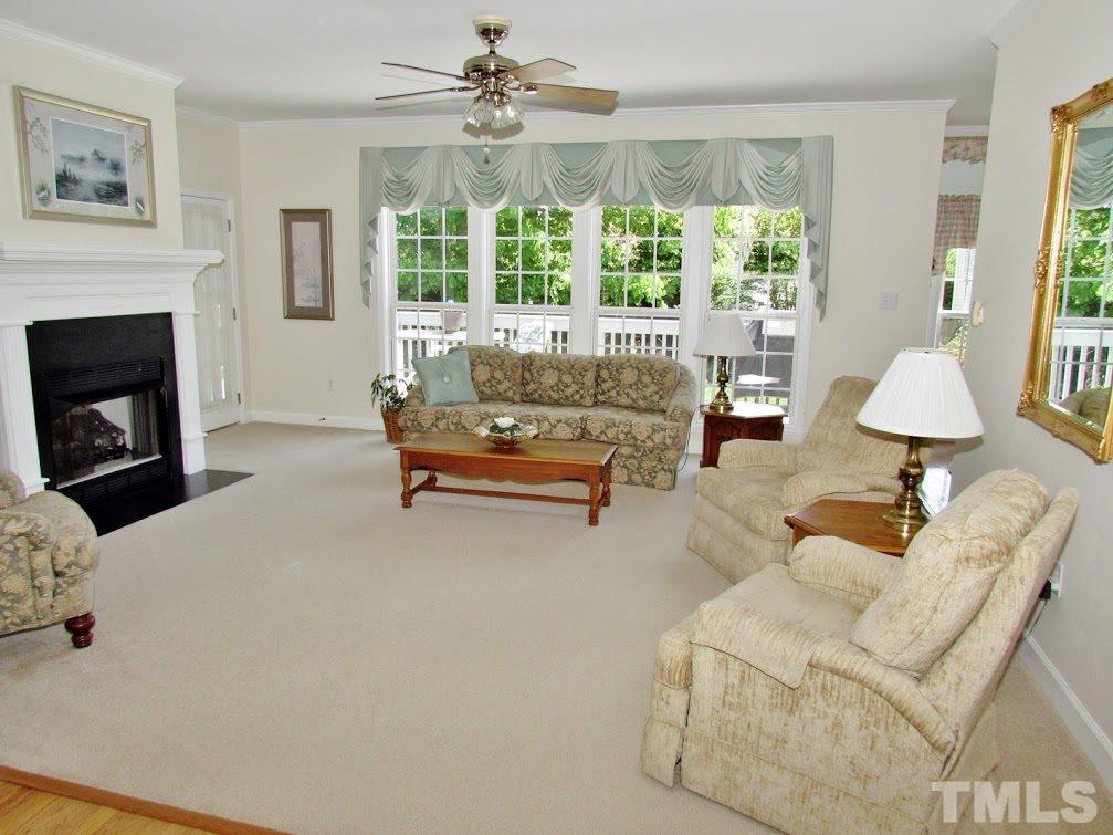 4720 Treadstone Court Raleigh, NC 27616 - Photo 24 of 25 Your main living area has wonderful natural light and a fantastic view of the awesome landscaped backyard. This open floor plan is great for family living or entertaining.
