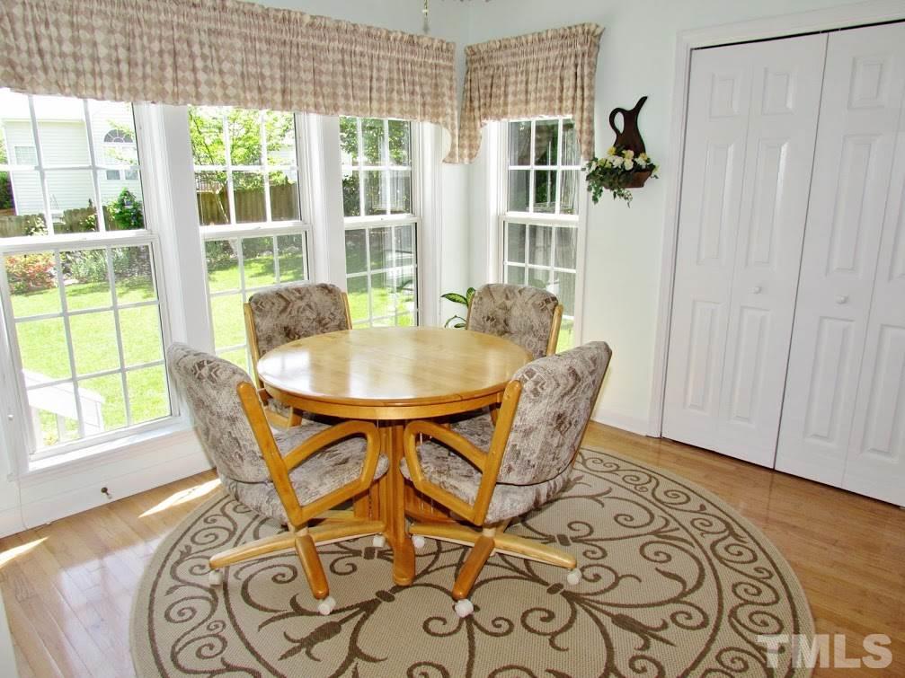 4720 Treadstone Court Raleigh, NC 27616 - Photo 6 of 25 Lovely Hardwood Floors are located in the foyer, Dining Room, Kitchen and Breakfast Room. Note the fabulous windows for lots of natural light and a great view of the gorgeous backyard!