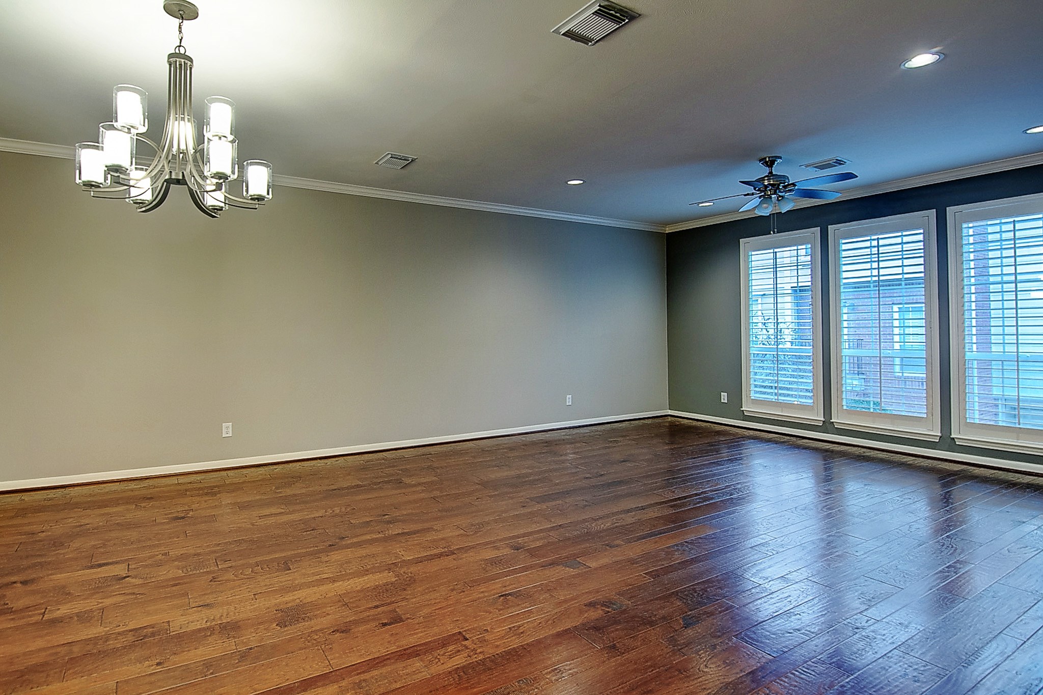 1408 West Webster Street Houston, TX 77019 - Photo 13 of 46 a view of an empty room with wooden floor and a window
