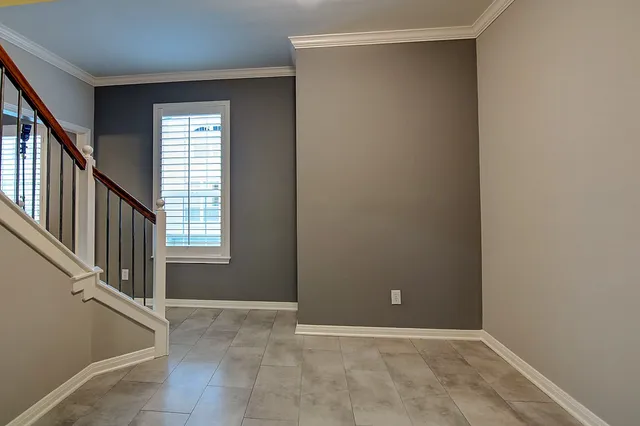 a kitchen with stainless steel appliances a stove a sink and a refrigerator