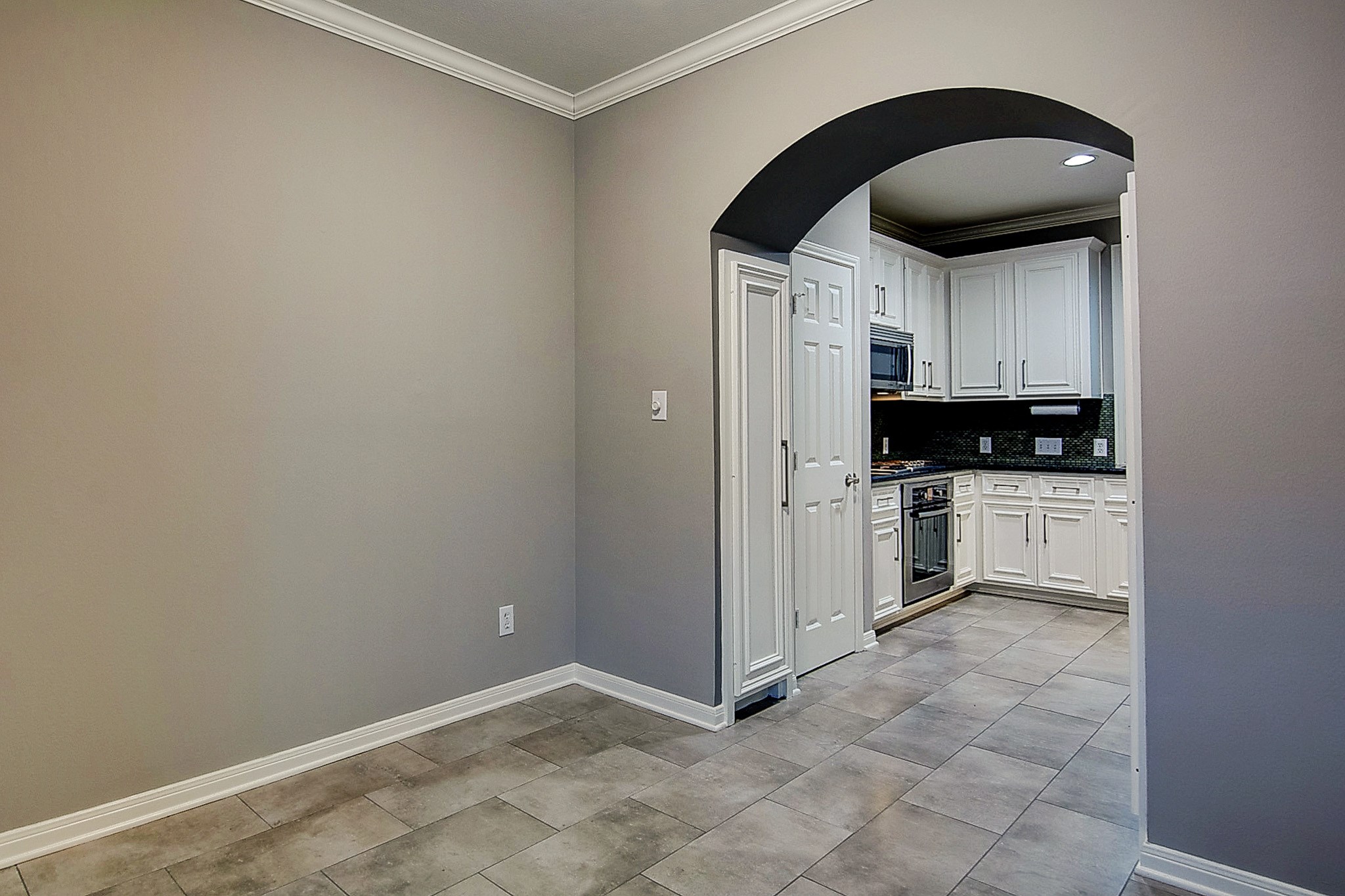 1408 West Webster Street Houston, TX 77019 - Photo 20 of 46 a kitchen with stainless steel appliances a stove a sink and a refrigerator