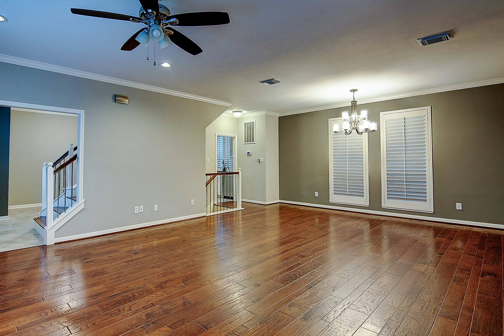 1408 West Webster Street Houston, TX 77019 - Photo 2 of 46 a view of an empty room with wooden floor and a window