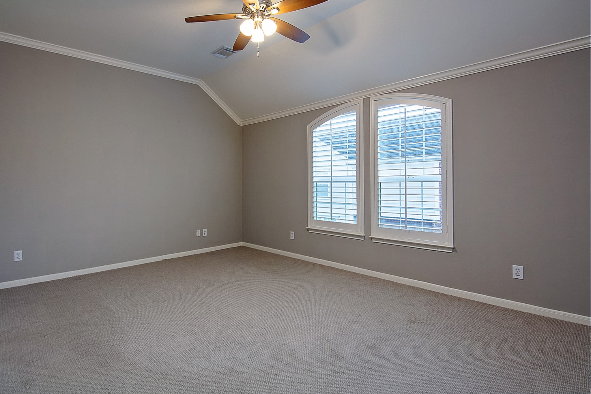 1408 West Webster Street Houston, TX 77019 - Photo 22 of 46 an empty room with chandelier fan and windows