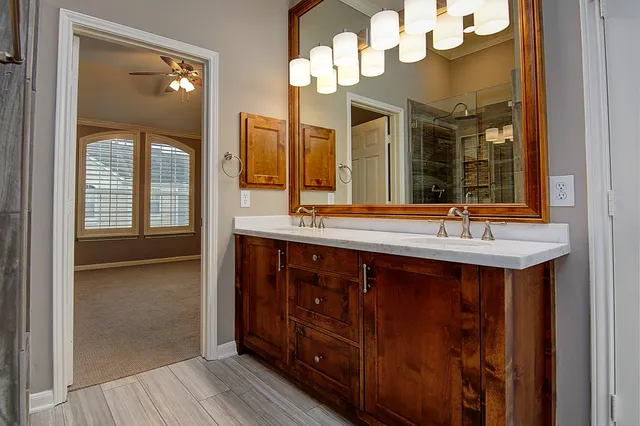 a large spacious bathroom with a large tub and sink