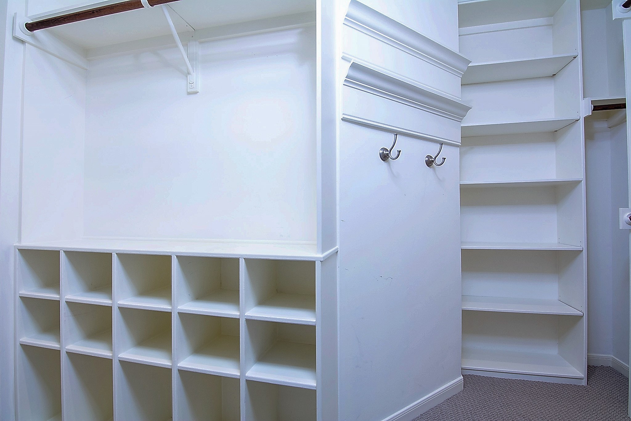 1408 West Webster Street Houston, TX 77019 - Photo 27 of 46 a view of walk in closet with empty racks