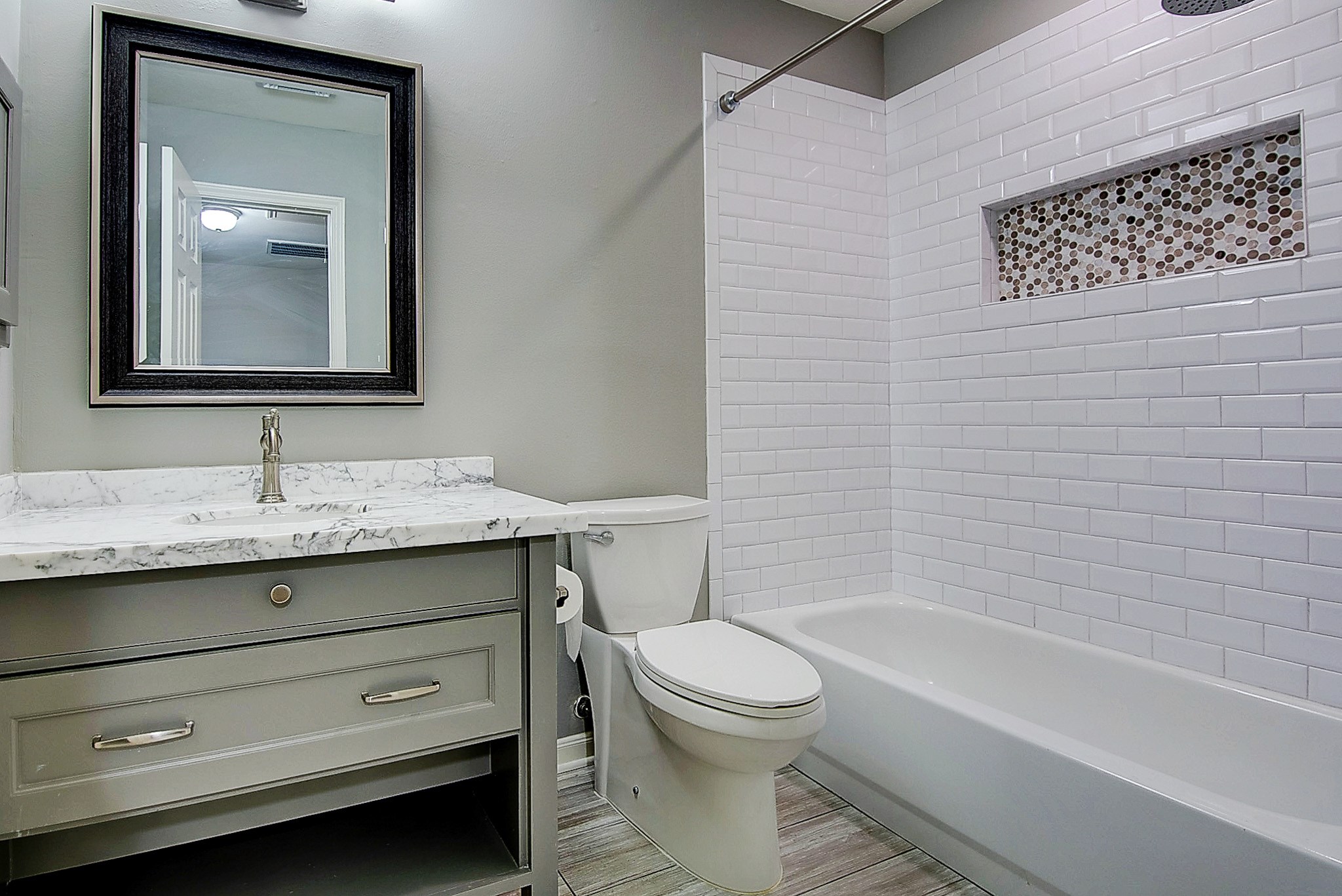 1408 West Webster Street Houston, TX 77019 - Photo 29 of 46 a bathroom with a sink a toilet and shower