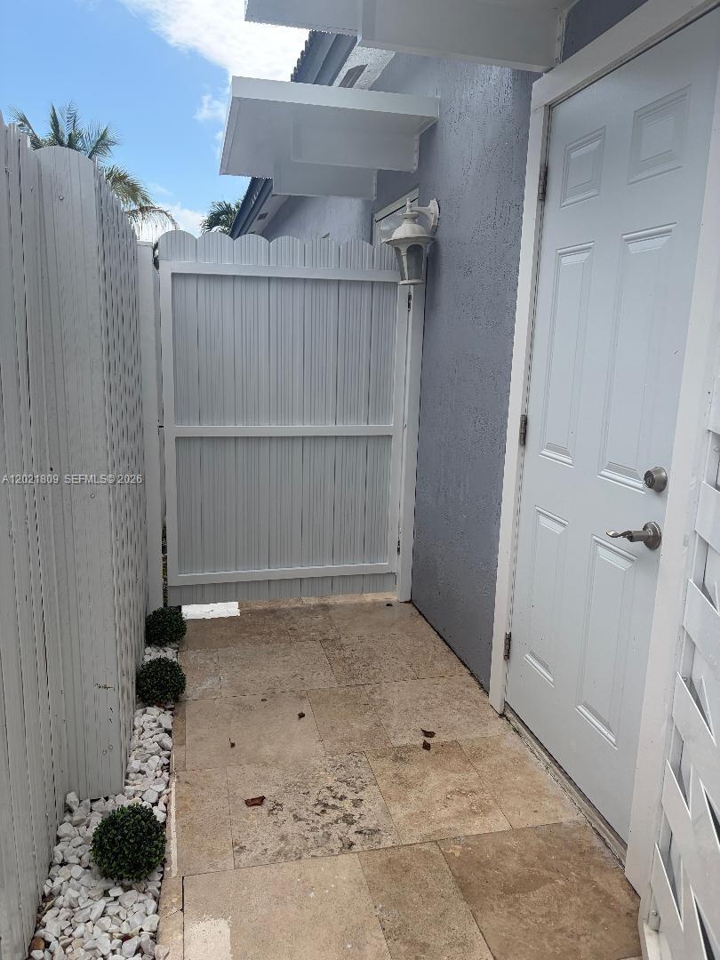 6803 Southwest 158th Avenue Miami, FL 33193 - Photo 2 of 6 an empty room with a wooden door