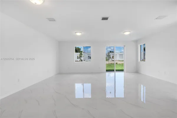 a view of a livingroom with wooden floor