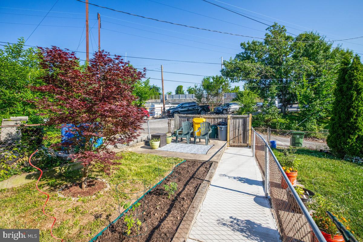 3574 Benzinger Road Baltimore, MD 21229 - Photo 28 of 29 Charming garden retreat with greenery.