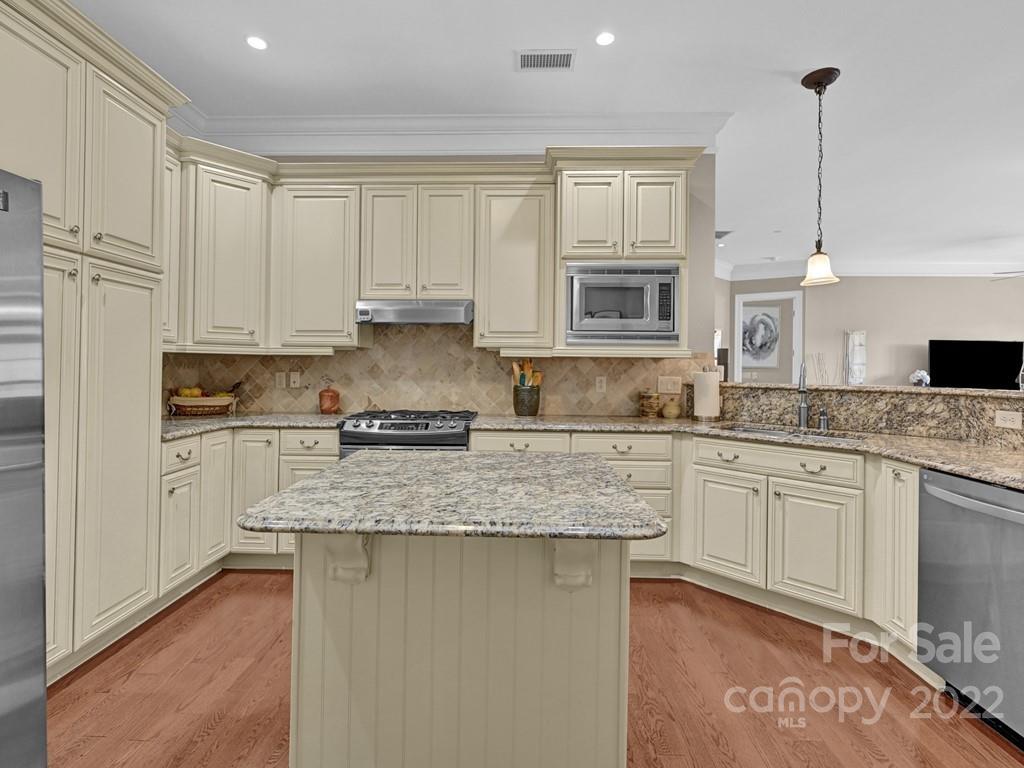 2823 Providence Road, Unit 125 Charlotte, NC 28211 - Photo 14 of 30 a kitchen with granite countertop white cabinets and white appliances