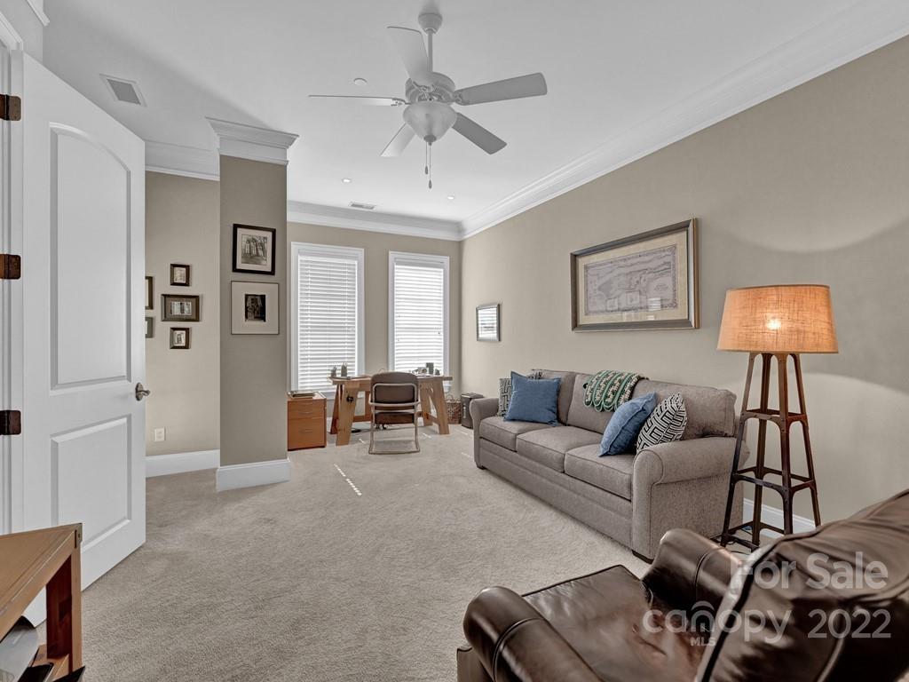 2823 Providence Road, Unit 125 Charlotte, NC 28211 - Photo 23 of 30 a living room with furniture and a lamp