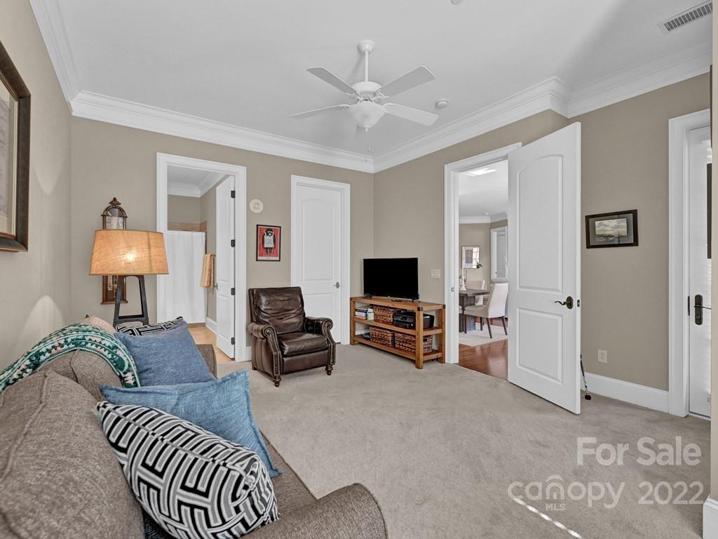2823 Providence Road, Unit 125 Charlotte, NC 28211 - Photo 24 of 30 a living room with furniture and a flat screen tv