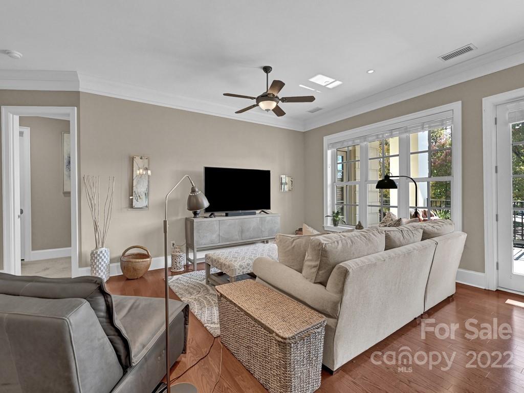 2823 Providence Road, Unit 125 Charlotte, NC 28211 - Photo 3 of 30 a living room with furniture and a flat screen tv
