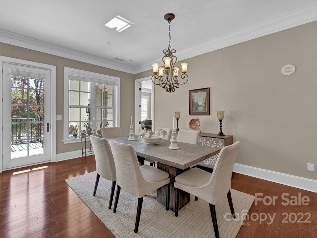 2823 Providence Road, Unit 125 Charlotte, NC 28211 - Photo 7 of 30 a view of a dining room with furniture window and wooden floor