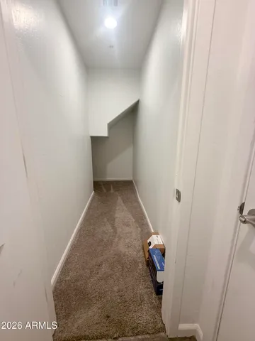 a view of hallway with stairs and couch