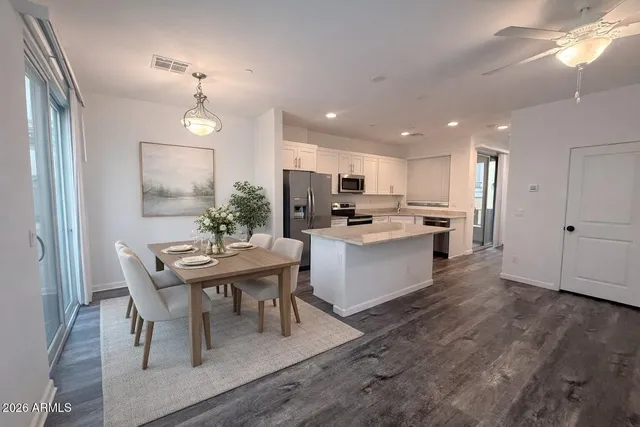 a view of kitchen with cabinets and wooden floor