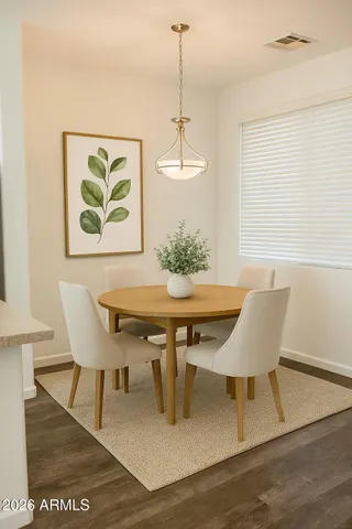 a dining room with furniture and window