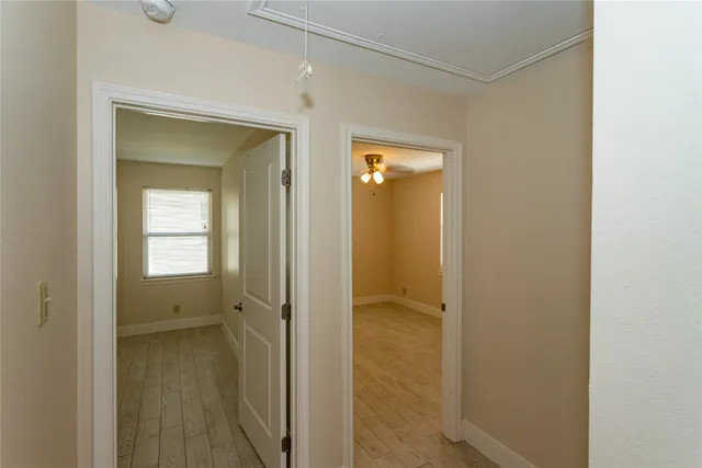 a view of a bathroom from a hallway