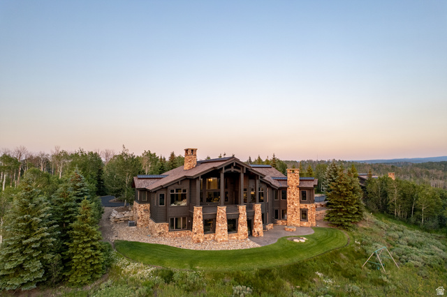 9156 Forest Road, Unit 24 Heber City, UT 84036 - Photo 37 of 42 Expansive mountain-style residence featuring a prominent stone and wood exterior