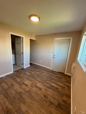 a view of an empty room and window