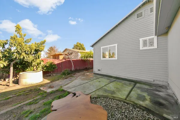 a view of a backyard with sitting area