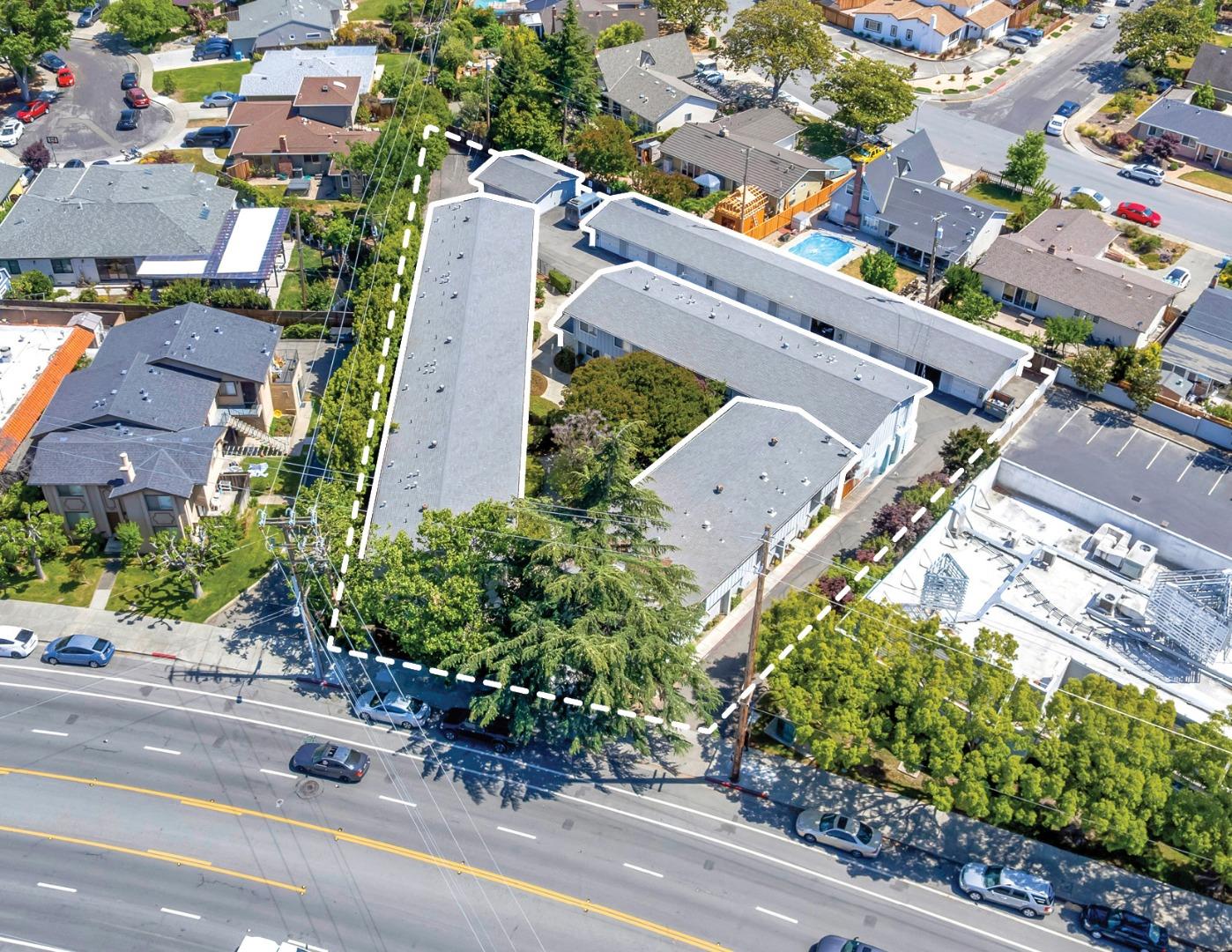 an aerial view of a house with a yard and garden