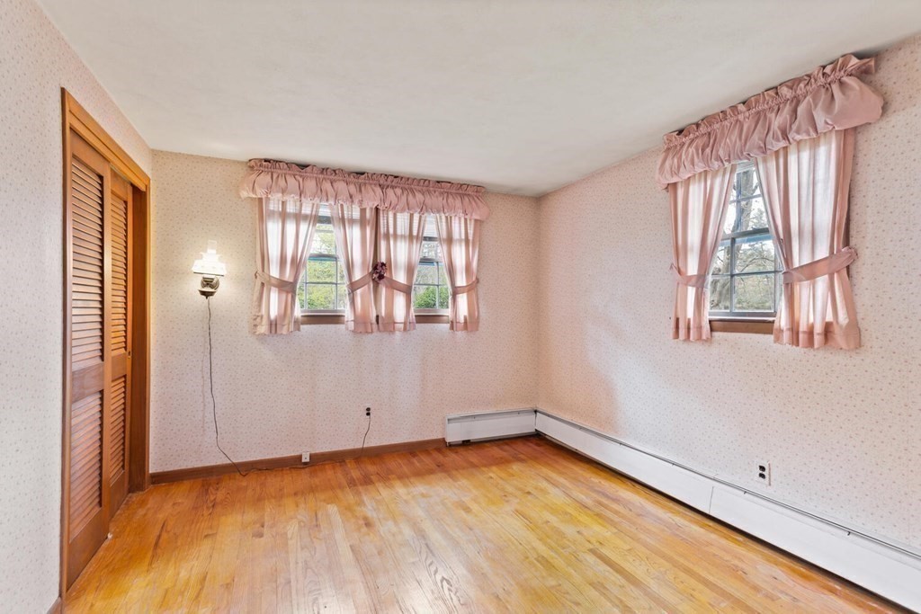 41 Ansie Road Chelmsford, MA 01824 - Photo 15 of 28 an empty room with wooden floor and windows