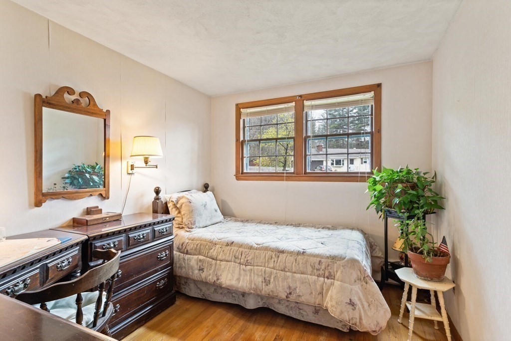 41 Ansie Road Chelmsford, MA 01824 - Photo 17 of 28 a bedroom with a bed and a potted plant