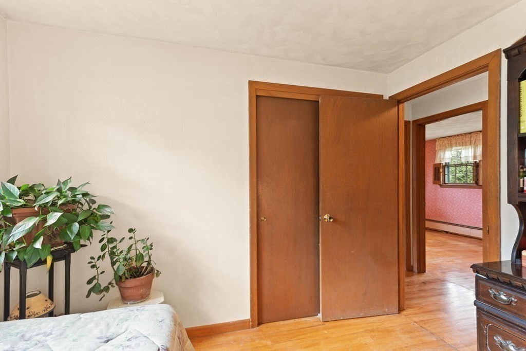 41 Ansie Road Chelmsford, MA 01824 - Photo 18 of 28 a view of a livingroom with wooden floor and a potted plant