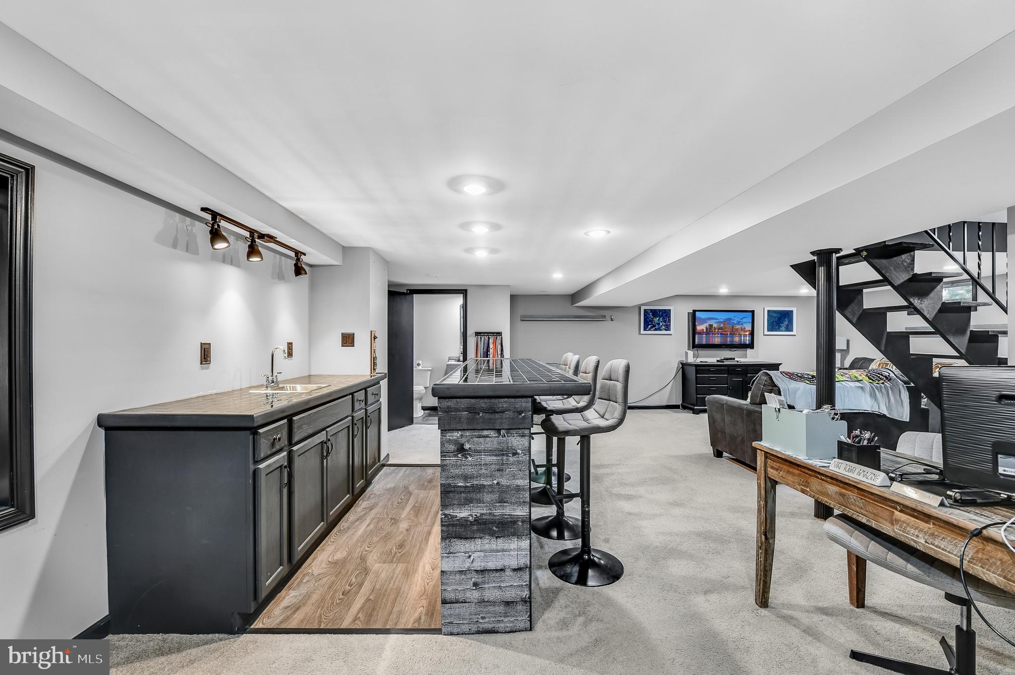 3226 State Hill Road Reading, PA 19608 - Photo 22 of 54 a living room with furniture a rug and a painting on the wall