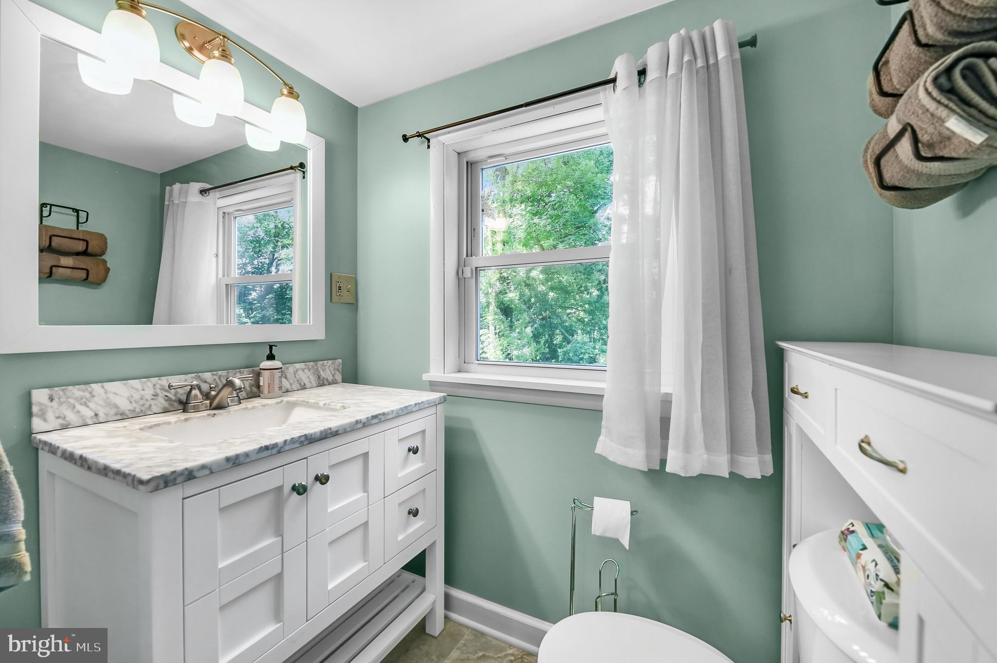 3226 State Hill Road Reading, PA 19608 - Photo 23 of 54 a bathroom with a granite countertop sink toilet and mirror