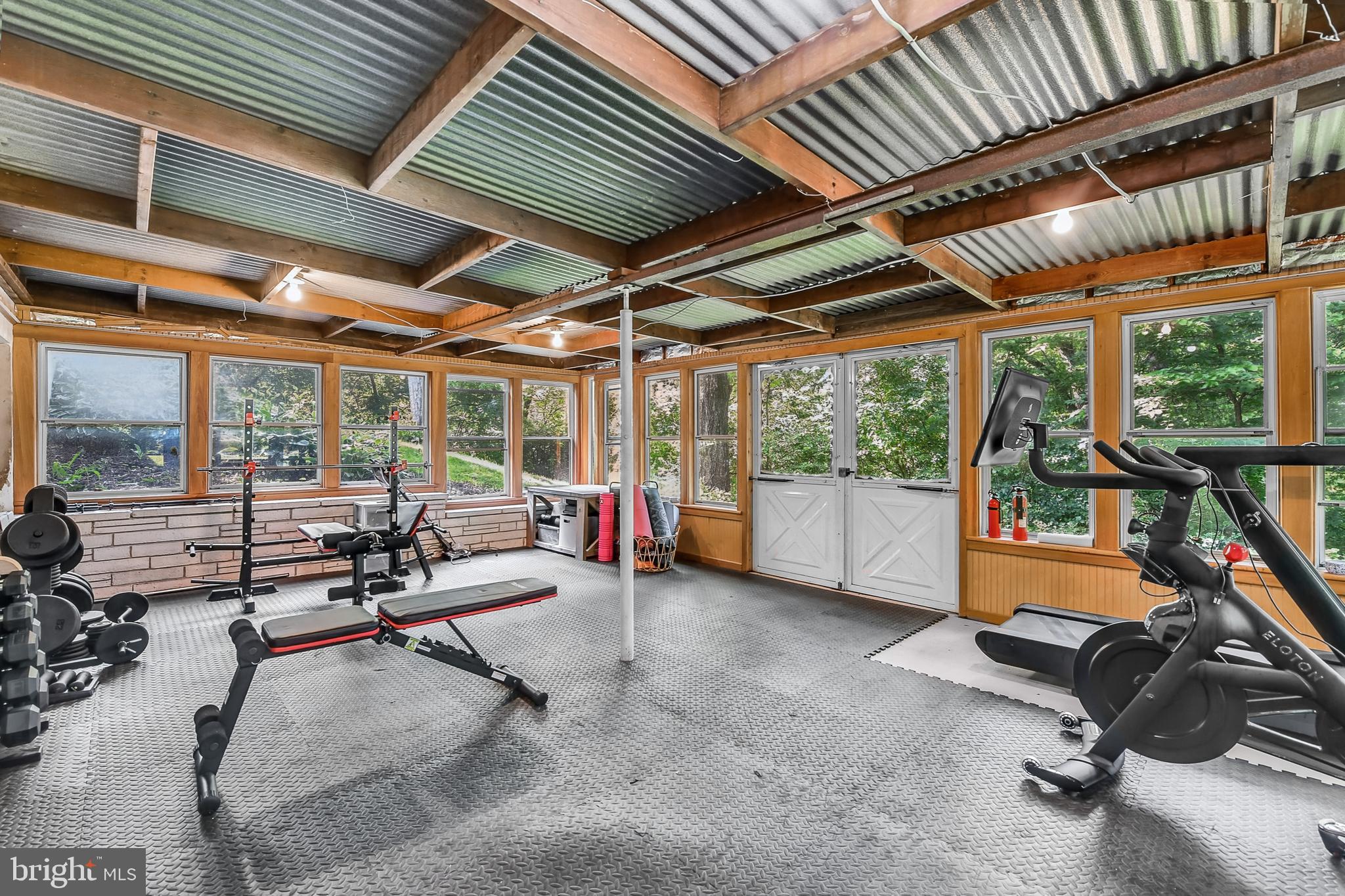 3226 State Hill Road Reading, PA 19608 - Photo 30 of 54 a view of a room with gym equipment and a large window