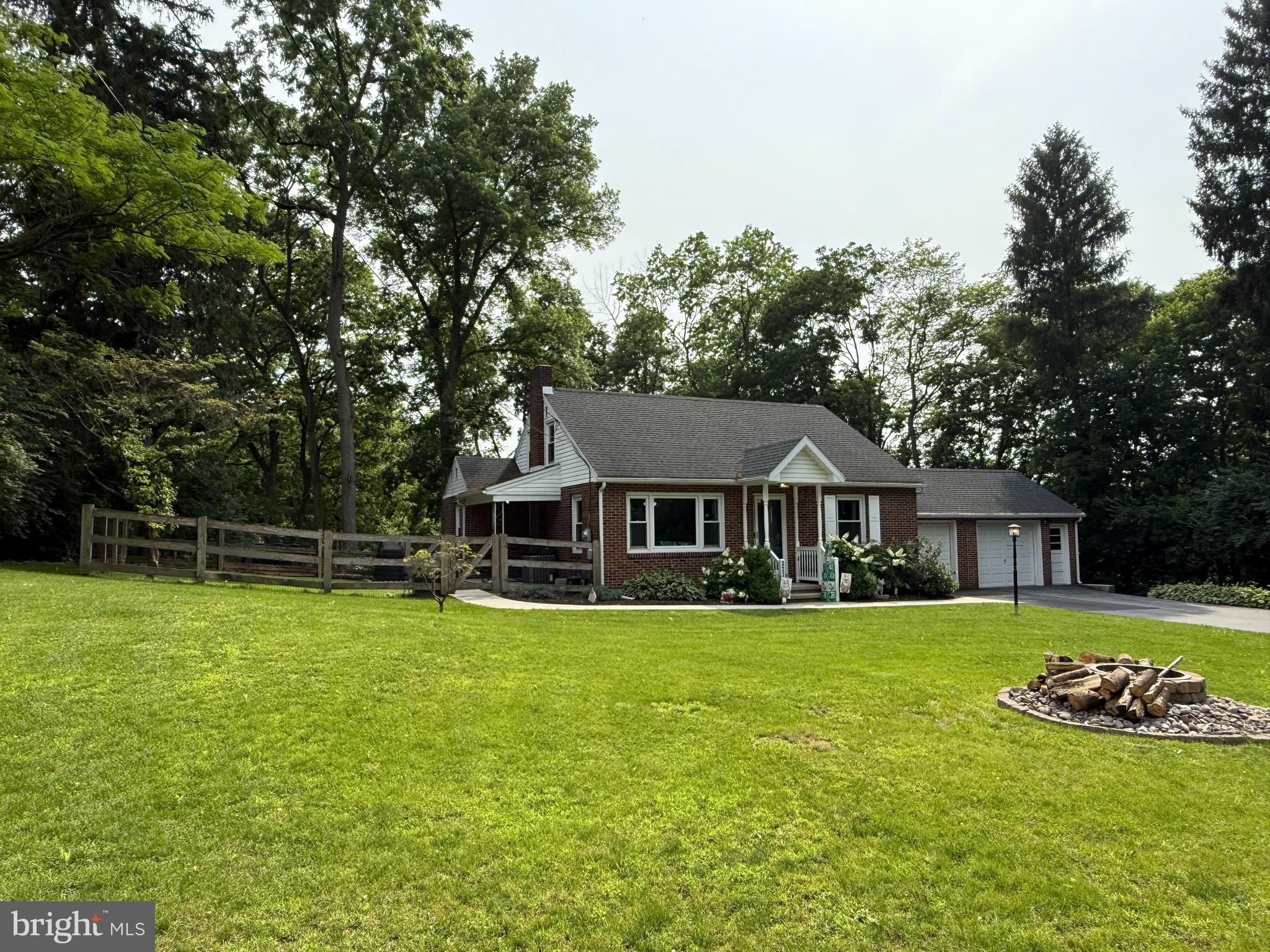 3226 State Hill Road Reading, PA 19608 - Photo 38 of 54 a view of a house with a big yard potted plants and large tree