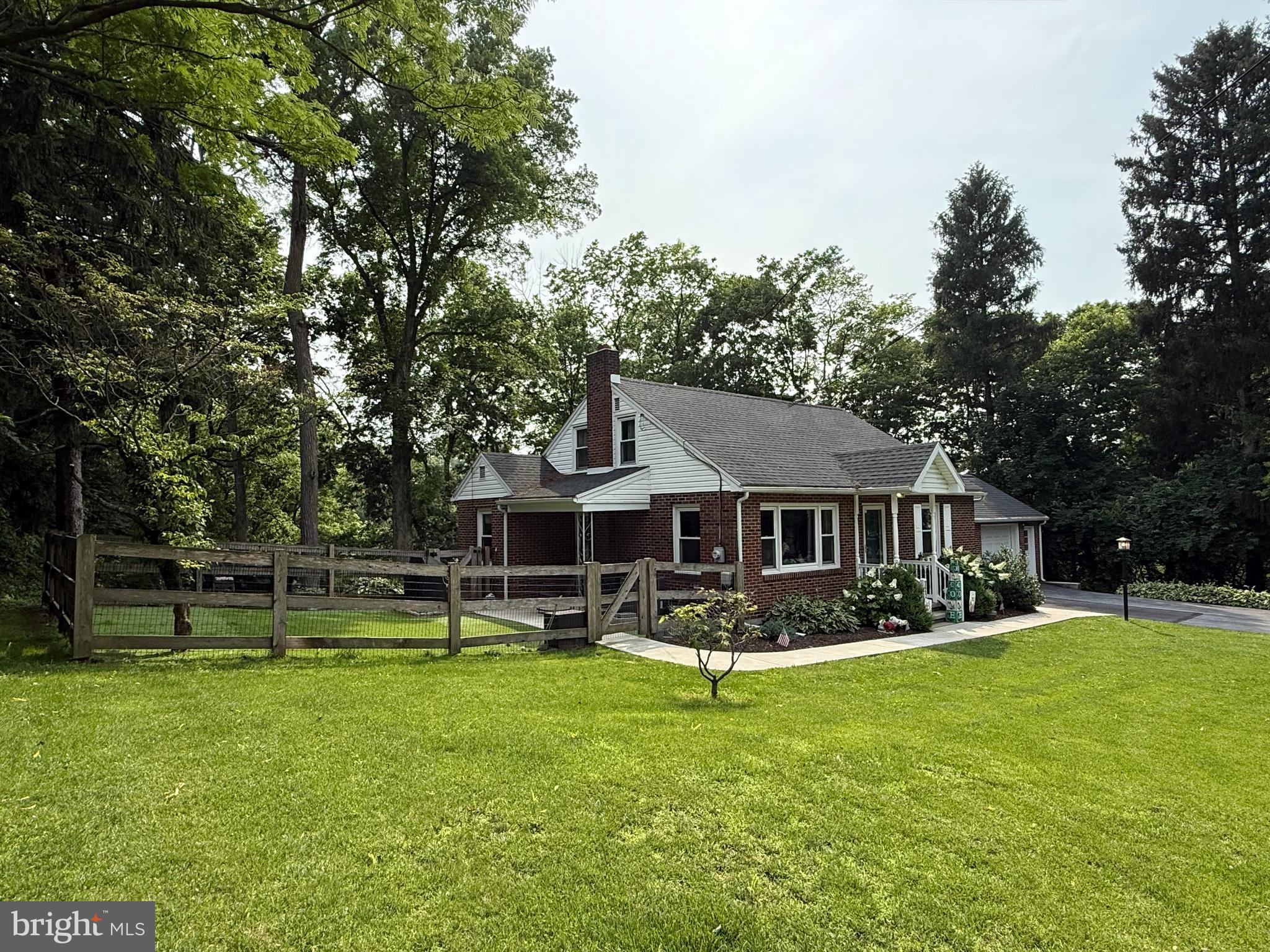 3226 State Hill Road Reading, PA 19608 - Photo 40 of 54 a front view of house with a garden and trees