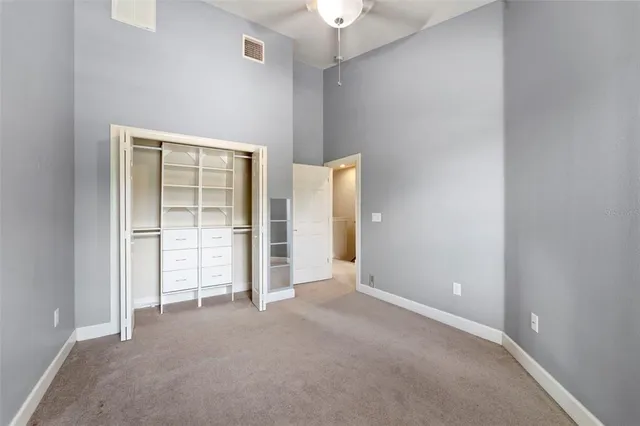 an empty room with closet area