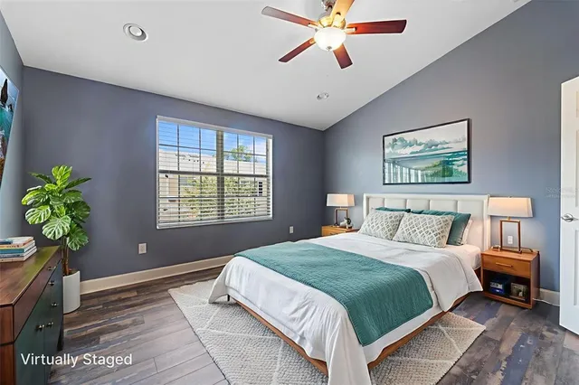 a bathroom with a granite countertop toilet sink and mirror