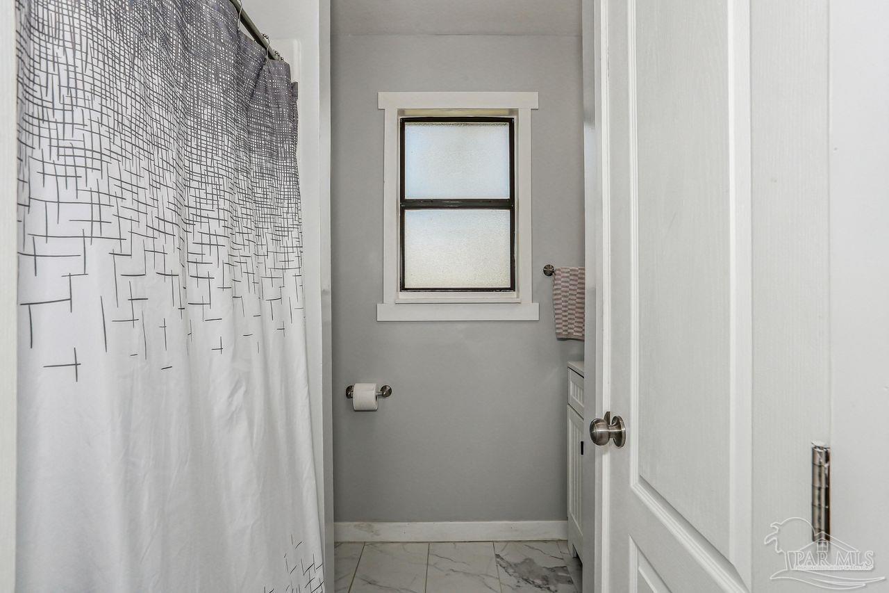 4010 Wyndham Road Century, FL 32535 - Photo 17 of 25 a bathroom with a window