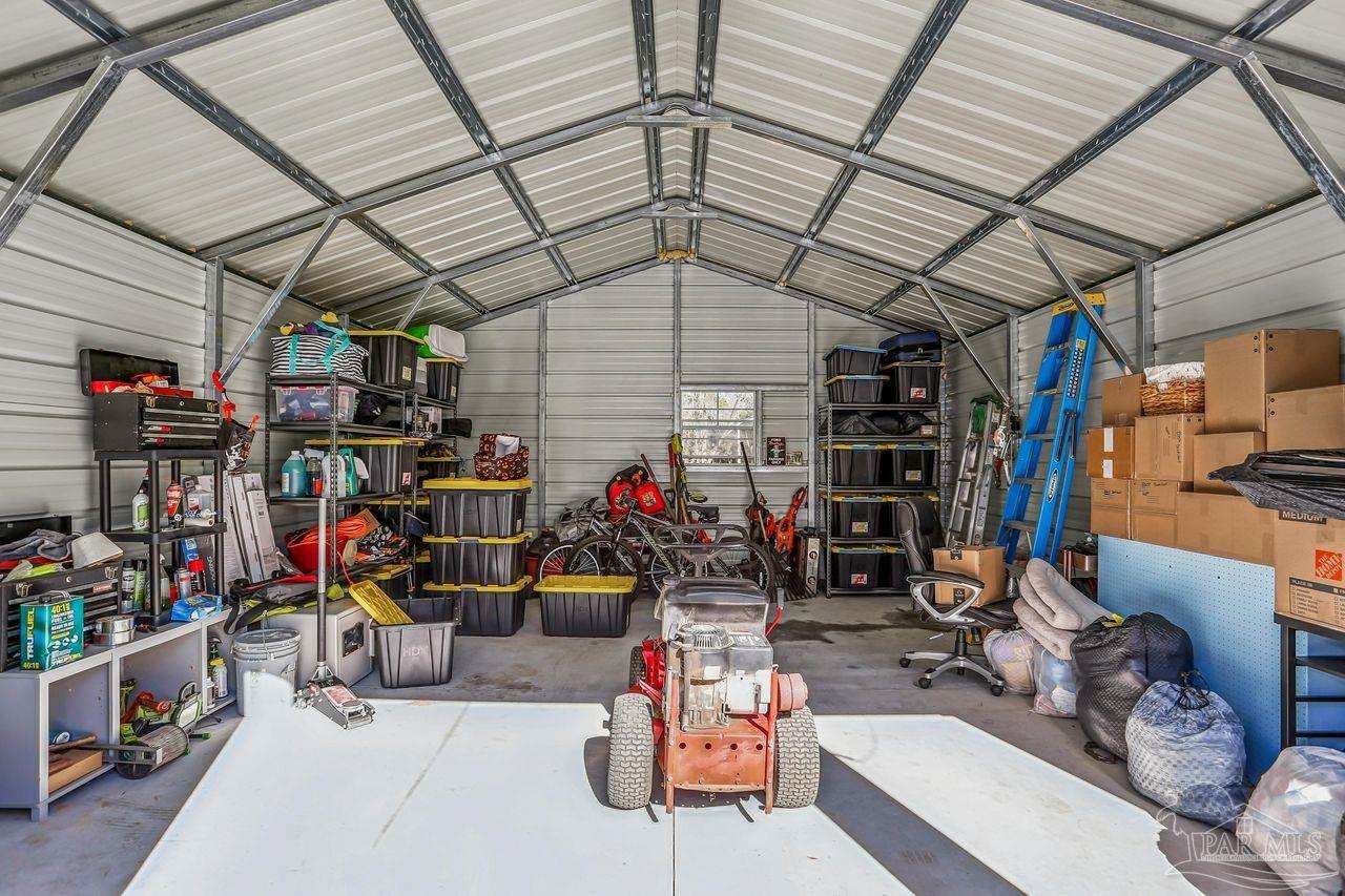 4010 Wyndham Road Century, FL 32535 - Photo 21 of 25 a view of a storage room with racks