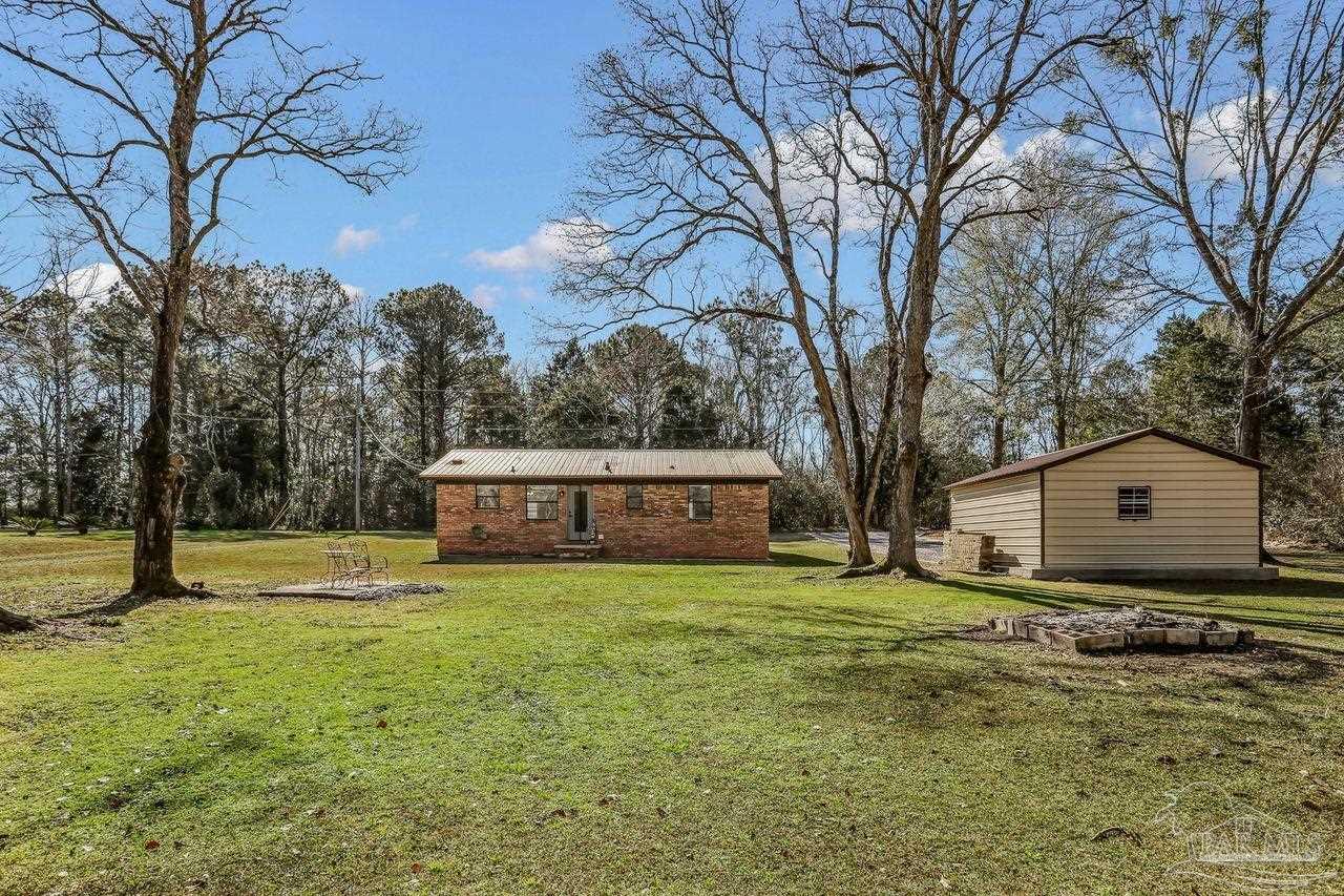 4010 Wyndham Road Century, FL 32535 - Photo 23 of 25 a view of a house with a yard