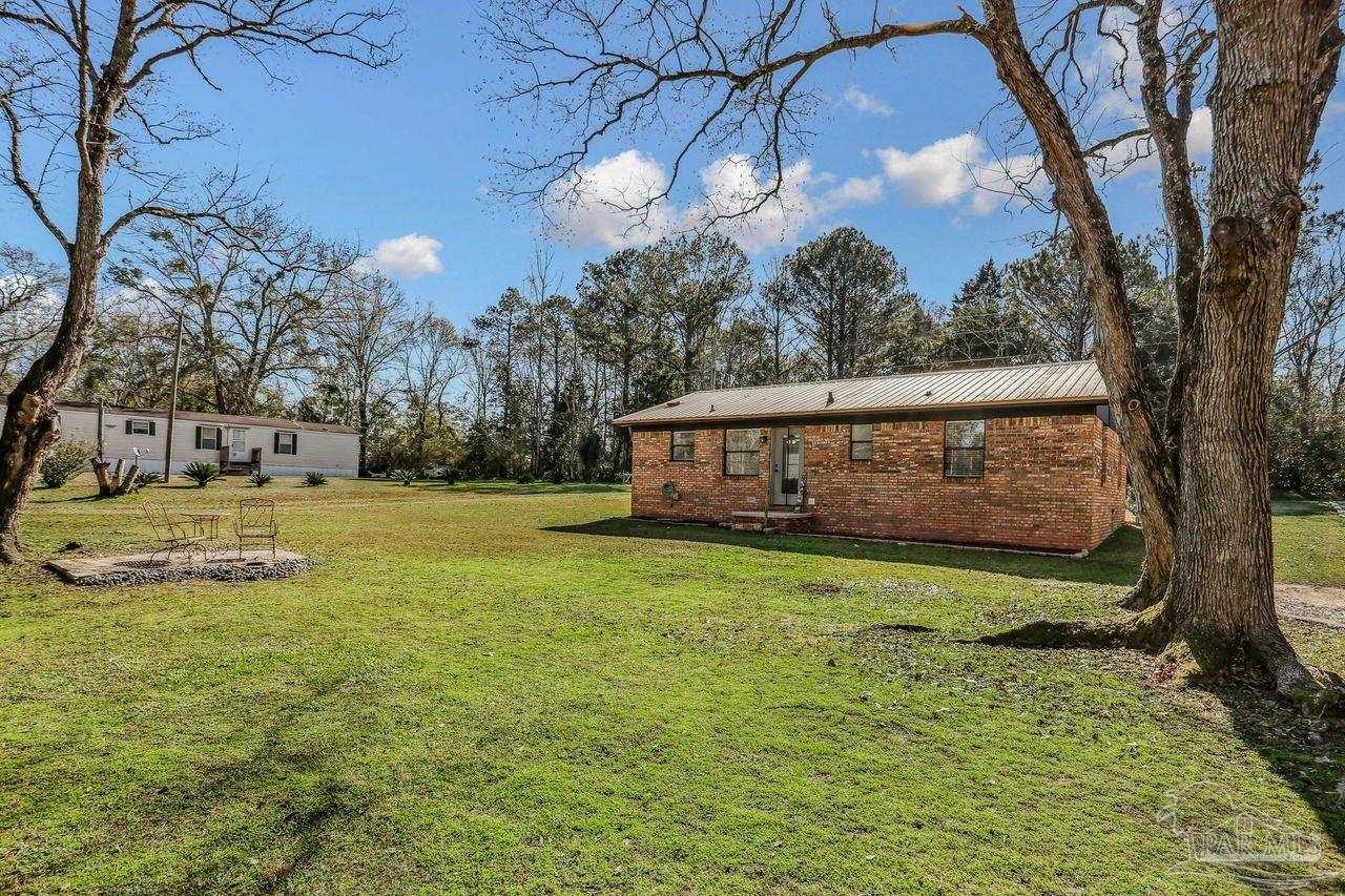 4010 Wyndham Road Century, FL 32535 - Photo 25 of 25 a view of a house with a yard