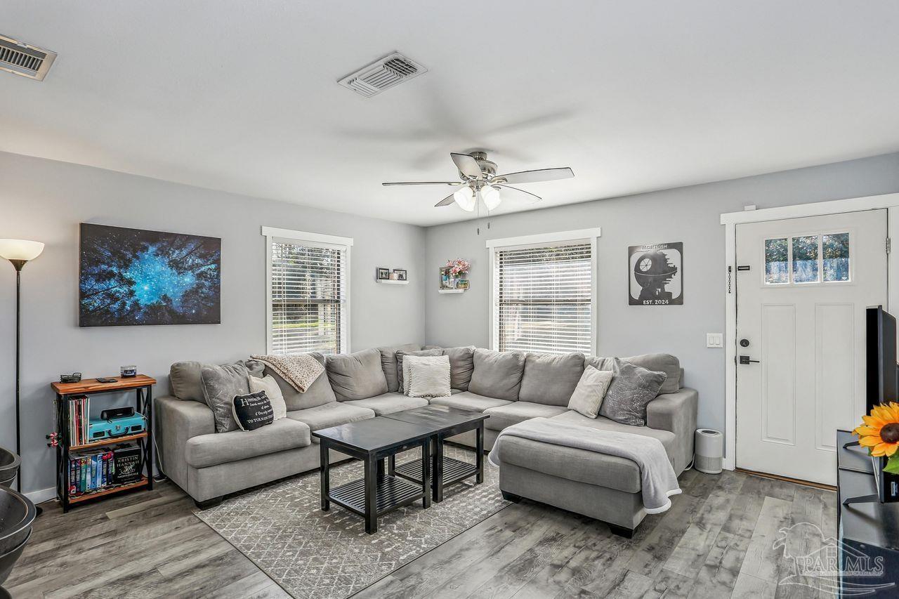 4010 Wyndham Road Century, FL 32535 - Photo 4 of 25 a living room with furniture and a large window